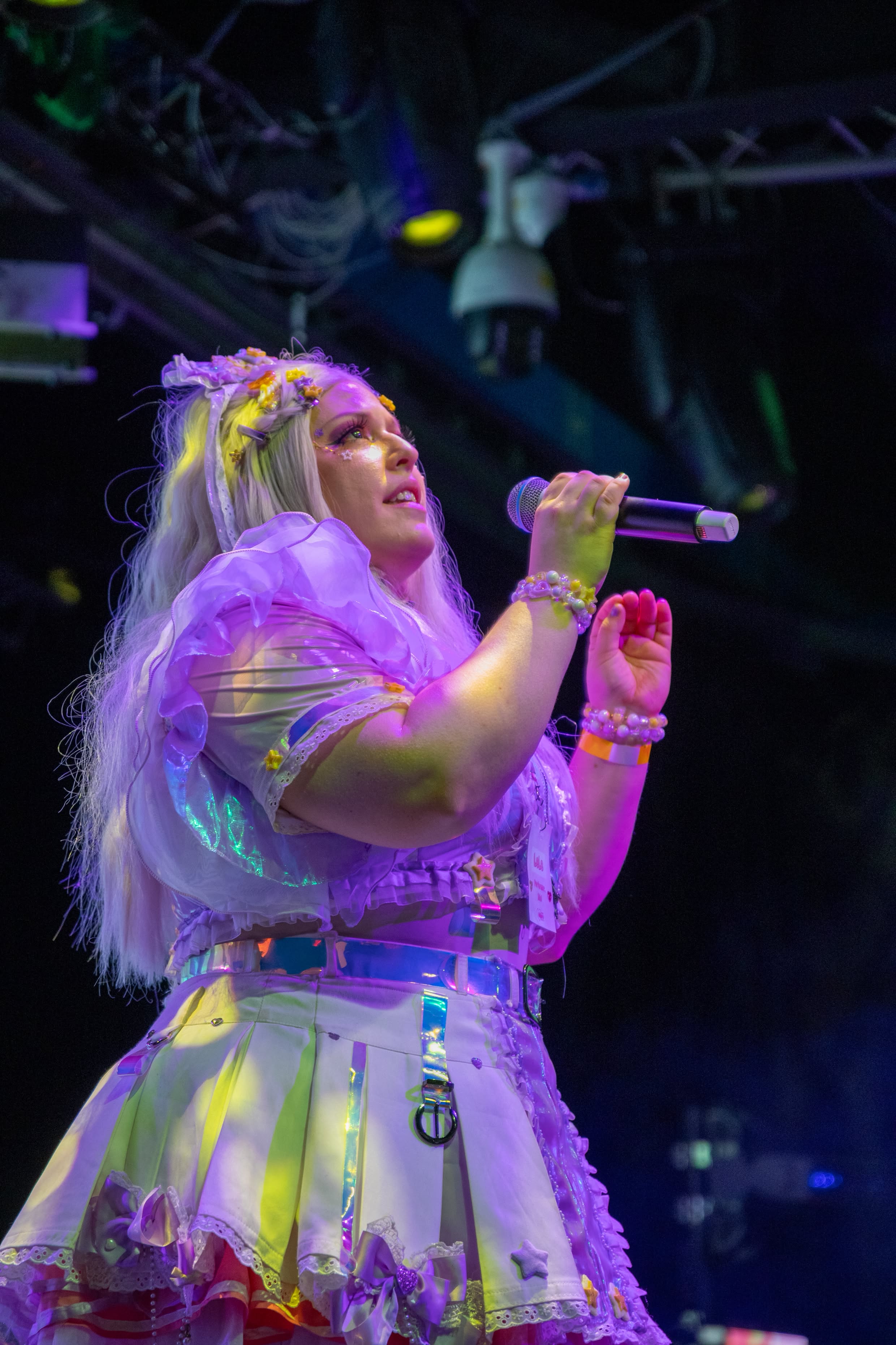 Performer singing into a handheld mic